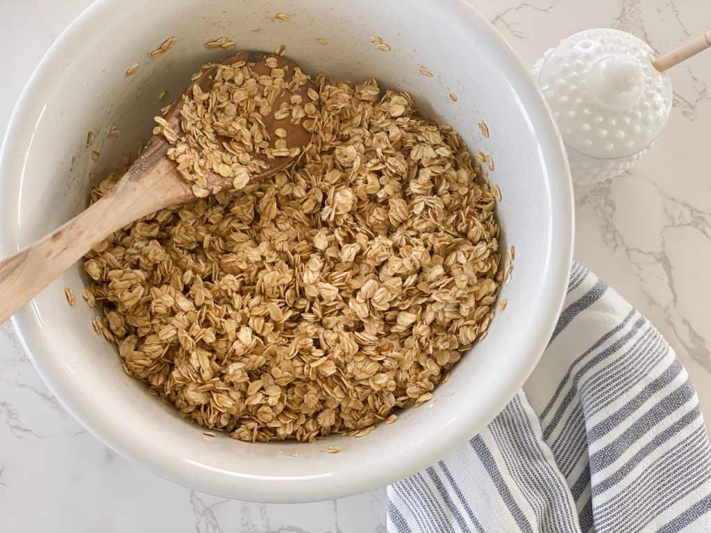 stirring together ingredients for granola