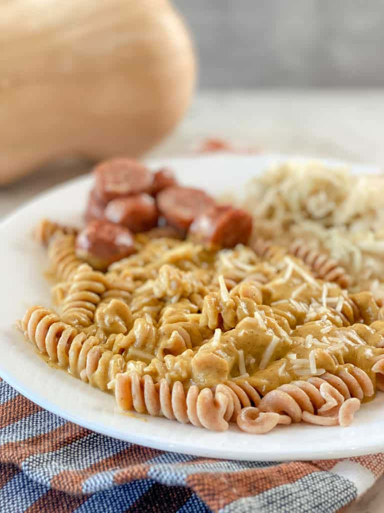 plate of pasta chicken sausage creamy sauce